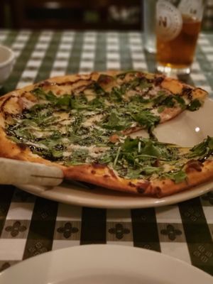 Canova Pizza- white pizza with prosciutto under the cheese, arugula and balsamic drizzle. To die for!!