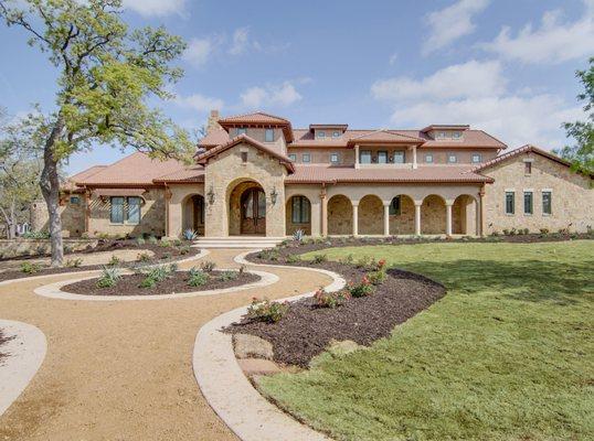 Custom stone house with tile roof