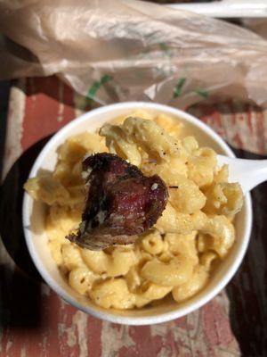 The perfect bite of mac & cheese and smoky brisket