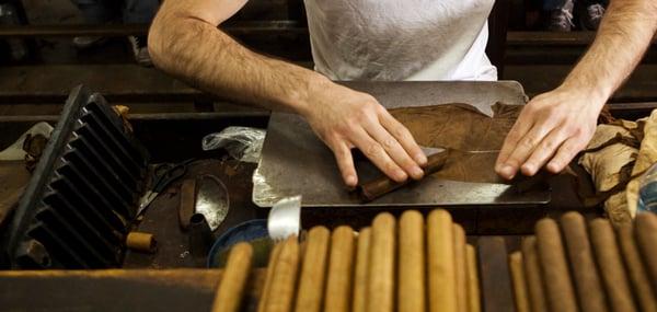 Cigar rolling in action during his training in Nicaragua