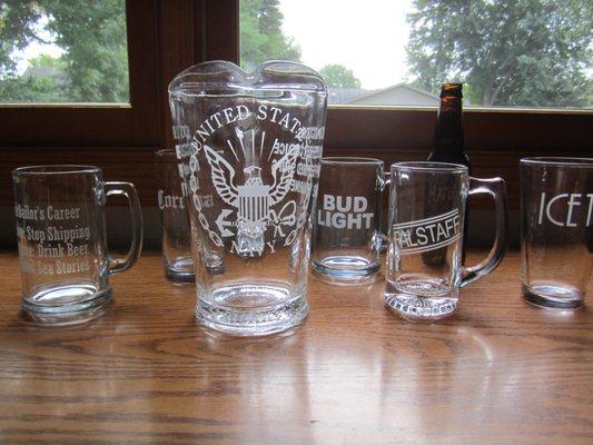 US Navy emblem etched on glass pitcher.