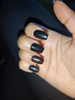 Black gel and red marble on ring finger