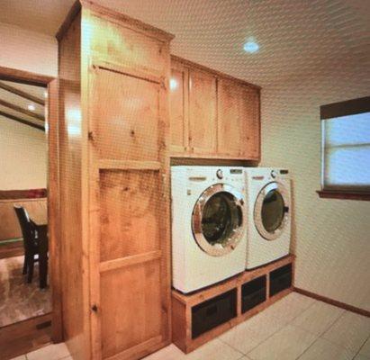 custom designed alder laundry room cabinets.