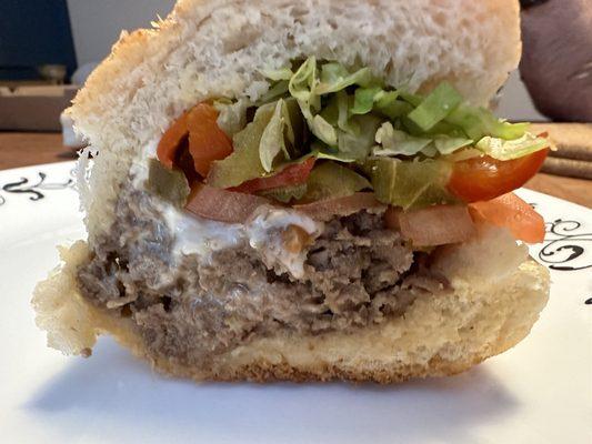 Cheesesteak with lettuce tomato and spicy peppers