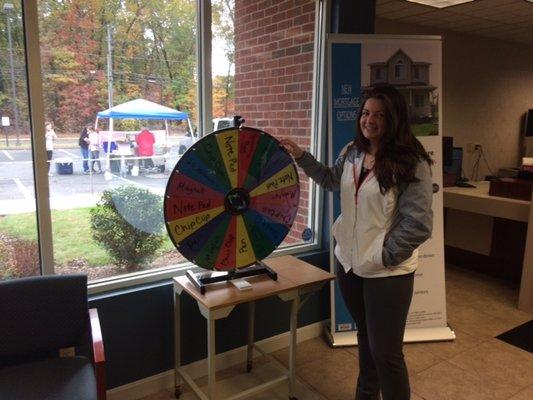 Member spins the wheel for a prize on Member Appreciation Day