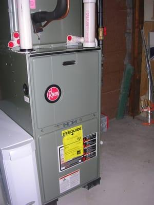 Rheem 95% upflow warm air furnace with AprilAire 2410 media filter