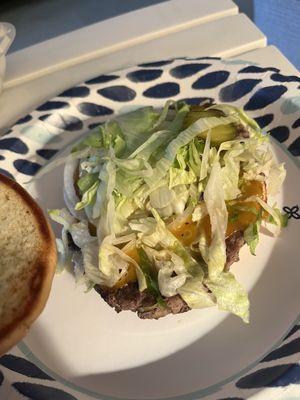 Cheeseburger with onion lettuce pickle