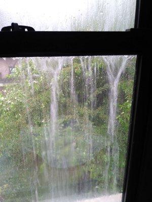 Rain hitting my window straight from the roof/gutters due to shoddy roof job.  I have videos too.