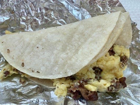 Outstanding Egg, bacon, and corn tortilla Breakfast Taco.  Very full taco, so satisfying, piping Hot! And that mild taco sauce, so good!!