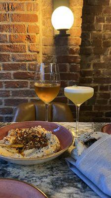 The hummus, one of their orange wine selections, and the Cantura Clouds cocktail.