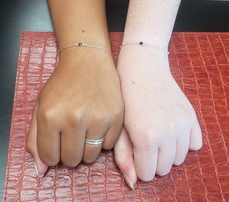 Permanent Jewelry With a BFF. Bracelets with  birthstone charm.