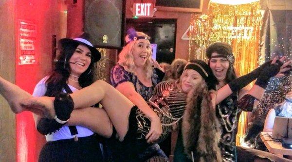 Roaring twenties party at bar with friends.