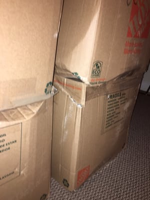 Crushed boxes and belongings in them.