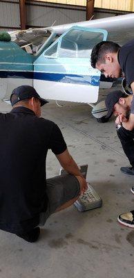 Our students performing the practice in our Hangar Facility.
Learning how to manage the IFR 6000 Tester.