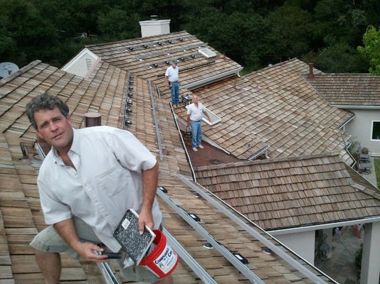 Four arrays on four separate roofs in order to get the power needed to offset a high energy bill, with Dave Petit and Greg Carey.