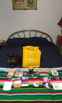 Our cat watching me take everything out of our goodie bag.  Thank you vendors!