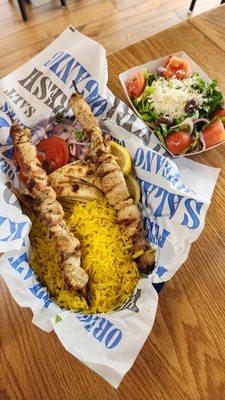 Chicken skewer meal with salad and rice