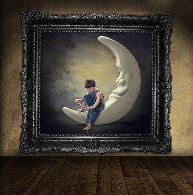 Portrait of boy sitting on moon