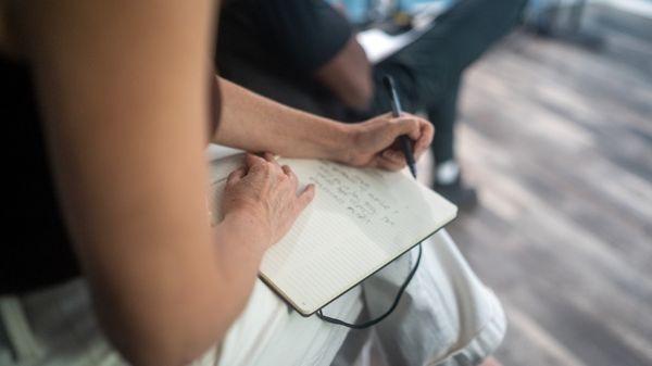 Taking notes during a scene.