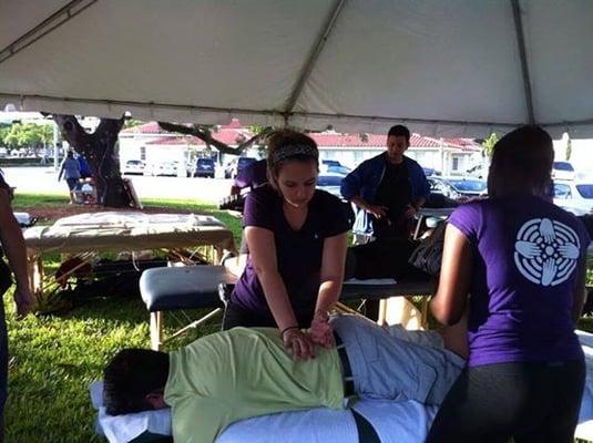 Volunteering at the Batist Health 5k in 2014, pre and post event sports massage.