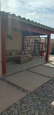 covered patio with clay tile roof.