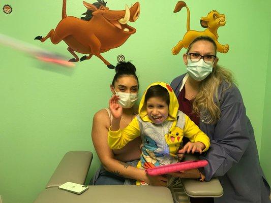 Our phlebotomist, Yvonne, with a patient and their Mom.