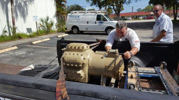 Scott setting up a 25 ton AC compressor for installation.