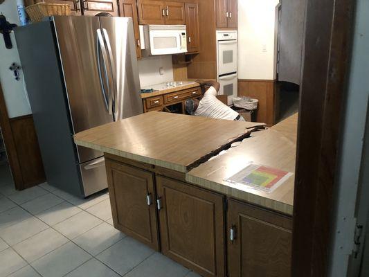 Before and after of kitchen and restroom counters converted to granite.