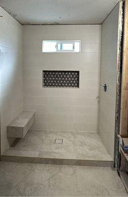 Walk in Shower.                             Ceramic tiles 12"x36".              Large format tiles 24"x48