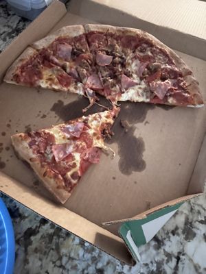 All meat pizza barely made it to a photo.