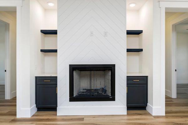 Beautiful custom shiplap fireplace with cabinets