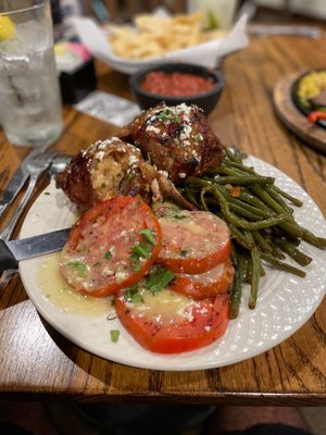 Bacon wrapped well, stuffed with Spanish dirty rice.