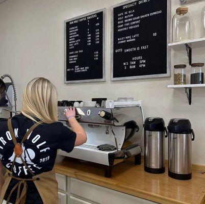 Barista and menu (from their Instagram @ironwolfcoffee)