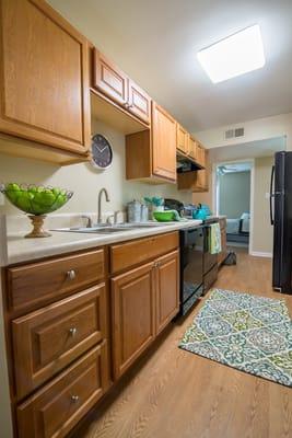 Oak Cabinets, Black Appliances and New Counter Tops