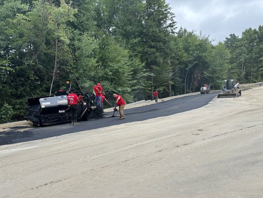 Asphalt paving applying to edge parking lot