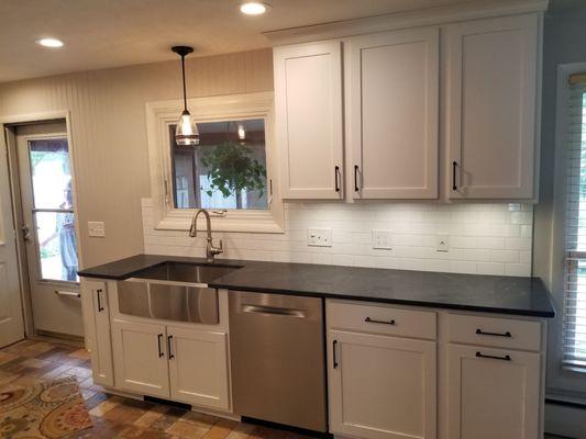 Light Grey Shaker Cabinets with Soapstone Countertop and Stainless Steel Farmhouse Sink