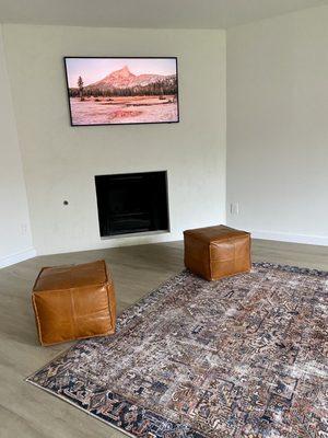 Samsung Frame TV mounted on concrete fireplace