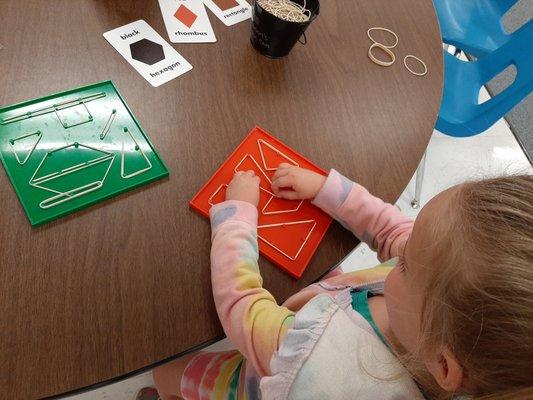 Shape Review while using fine motor skills, spatial awareness and GeoBoards to recreate a shapes.