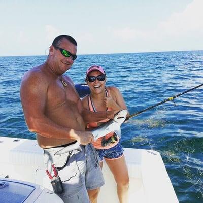 This is a picture of Captain Keith and I holding the shark I caught! He really helped me!