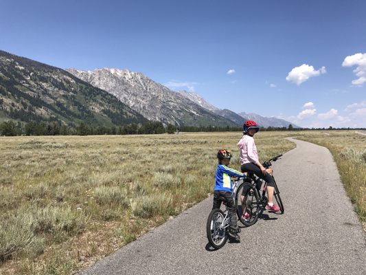 Tandem ($20) bike fitted my small 7 years old. He helped mom on those hills, too