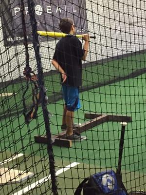 practicing balance while hitting w Coach Ken Luckham