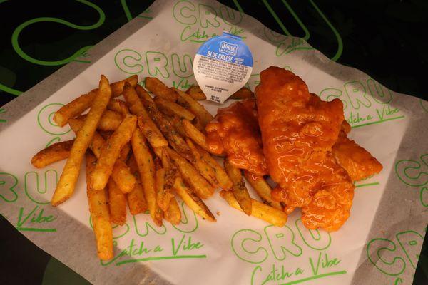 Buffalo tossed chicken tenders with seasoned fries