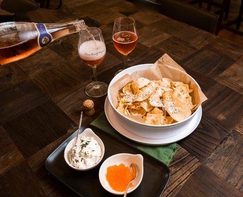 Cacio pepe kettle chips with locally sourced trout caviar paired with the Davis Family sparkling rose!