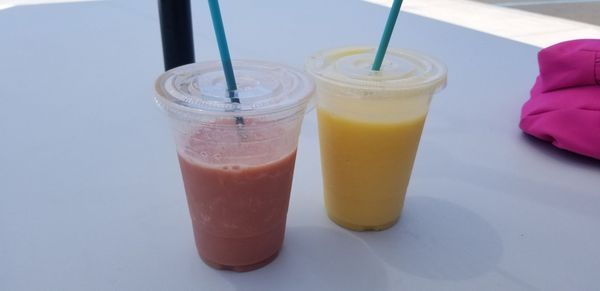 Dreamsicle with plant-based vanilla protein (left), R+R with pineapple, mango, and RUM!!! (right)