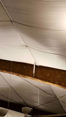 Rusted beams over the kid's soccer turf