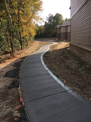 Concrete sidewalk with 6" "slick edge"