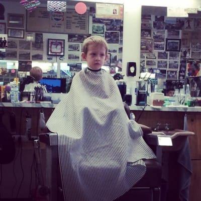 John getting his hair cut.