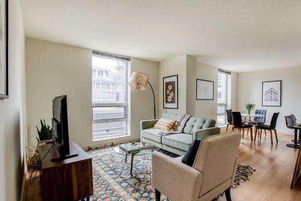 Living and Dining Room, each with a floor to ceiling window in each