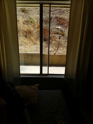 Pathetic patients' rooms w/ view of dead grass/dirt hills; very poorly managed; tiny, smelly and dirty; bathroom's shared by 4 patients