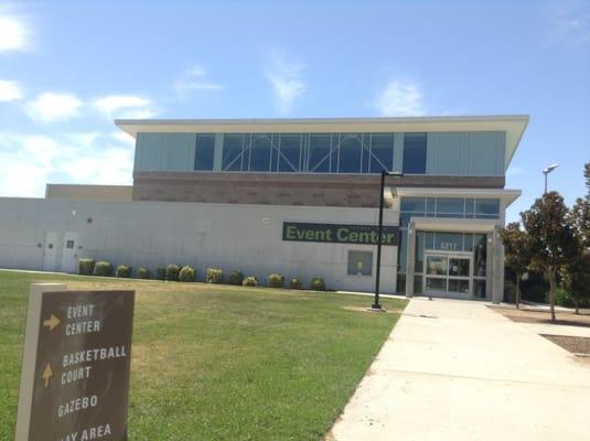 George sims event center/community center, with tables and chairs to enjoy the outside weather.